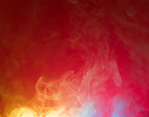 yellow and blue smoke on red background