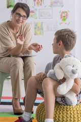 Boy is holding stuffed toy
