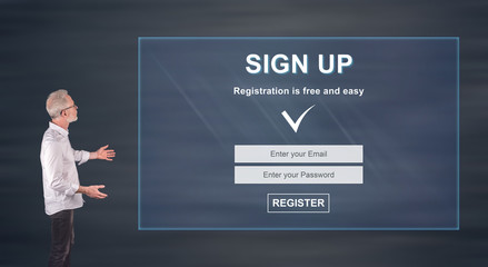 Businessman presenting a signup concept on a wall screen