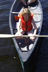 Obraz premium Bird's eye of girl in canoe