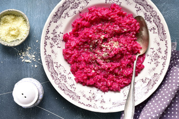 Beetroot risotto with parmesan cheese.Top view.
