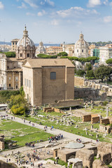 ancient Curia Julia on the Roman Forum against Colosseum, Rome, Italy, Europe