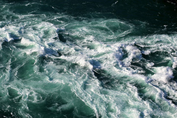 Looking Down At A River With A Fast Moving Current