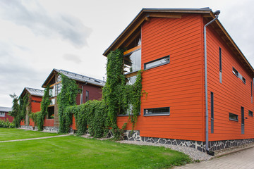 Obraz premium Quarter of red wooden houses