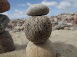 Fototapeta na wymiar Tower of stones in the beach of Lithuania 