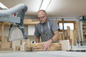 Carpenter working in workshop