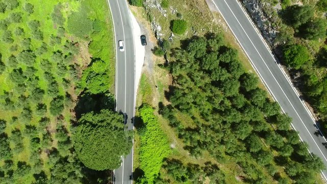 Aerial view of road across mountains.