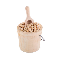 Soybeans in a wooden cup isolated on white background