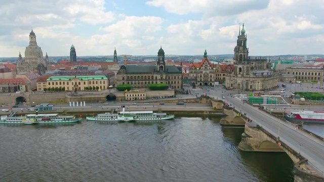 DRESDEN, GERMANY - JULY 2016: Aerial view of ancient buildings along city river. Dresden is a famous medieval town.