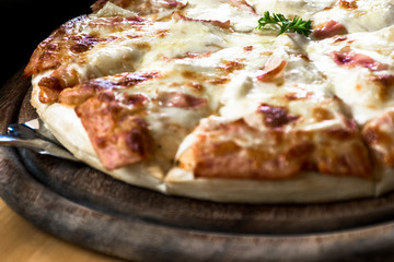 Close up Italian pizza about cheese it stick. Selective focus.Slice of hot pizza large cheese lunch or dinner crust seafood meat topping sauce.Hot Homemade Pepperoni Pizza Ready to Eat
