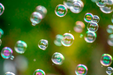 Soap bubbles in nature as a background blur