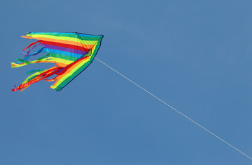kite flying high in the sky symbol of freedom and joy