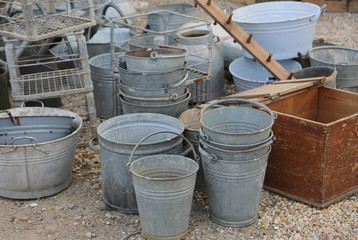 Fototapeta premium old tin buckets for sale in the flea and antiques market
