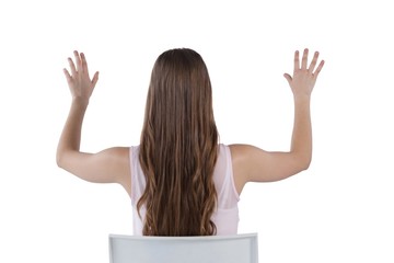 Girl pressing an invisible virtual screen against white