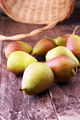 Fresh ripe organic pears on rustic wooden table, natural background, vega, diet food