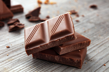 Dark Chocolate chunks and stacked broken chocolate bar.