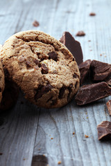 Chocolate cookies on wooden table. Chocolate chip cookies shot.