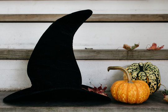 Witch hat and pumpkins on steps