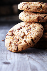 Chocolate cookies on wooden table. Chocolate chip cookies shot.