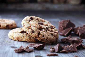 Chocolate cookies on wooden table. Chocolate chip cookies shot.