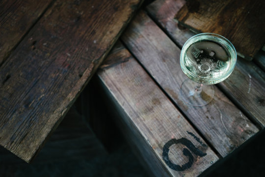 Glass of prosecco on a crate at a pop up in London