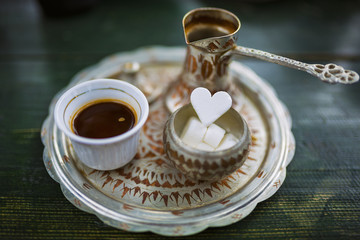 Traditional bosnian coffee on a green table