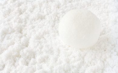 Snowball on White Snow Background