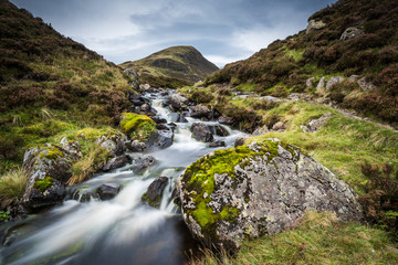 Fototapeta na wymiar The Outflow from Loch Skeen on Tail Burn above The Grey Mares Tail