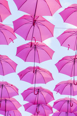 Fototapeta na wymiar pink umbrellas background 