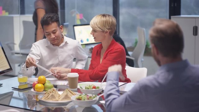  Business team in a breakfast or lunch meeting with food & refreshments
