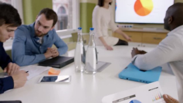  Young casual business team in a meeting in city office