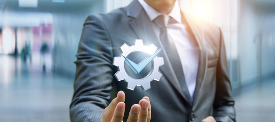 Businessman showing a symbol of a job well done .