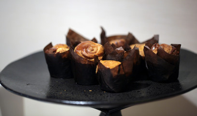 small brown cookies on a black tray