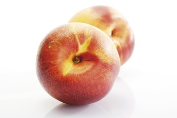 Two fresh nectarines