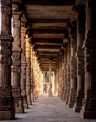 Qutub Minar, stone pillars with carvings of erstwhile Temples