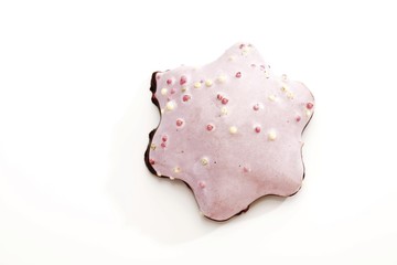 Sugar glazed gingerbread star biscuit with sugar pearls