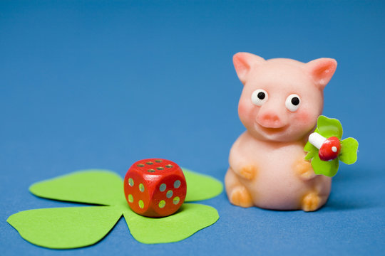 Lucky charm pig of marzipan and dice