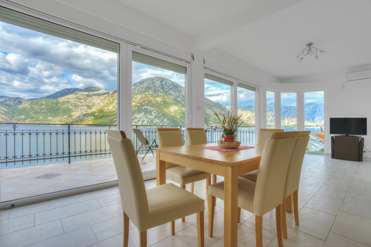 Dining area in a living room in a villa with beautiful mountain and sea view