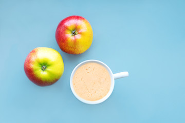 Coffee in a white mug on a blue background