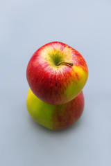 Two apples on a blue background