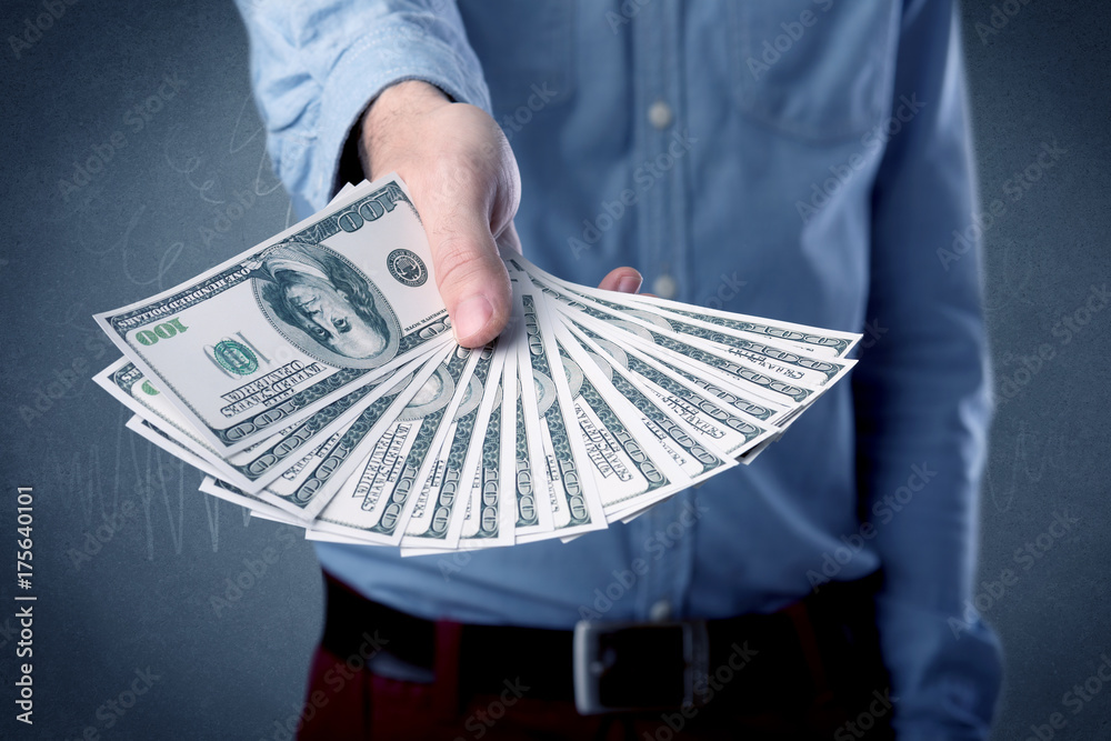 Wall mural businessman holding money