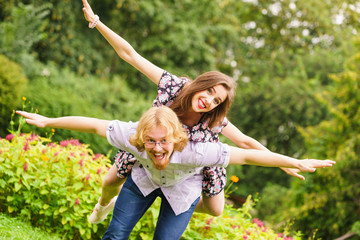couple having fun piggyback riding