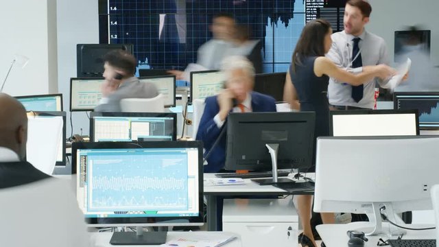  Timelapse of city stockmarket traders, at work in a chaotic trading room