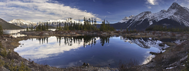 Panoramic Landscape view of upper Kananaskis Lake and Distant Snowy Mountain Tops in Peter Lougheed Provincial Park, Rocky Mountains, Alberta, Canada