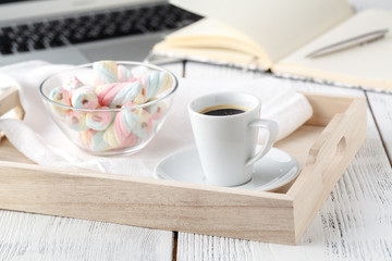 Warm cozy home. Tray and cup of coffee with marshmallows