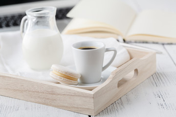 Fototapeta na wymiar cup of coffee, cream on wooden tray