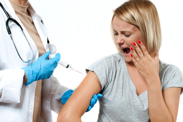 Vaccination. Doctor with syringe making vaccination to patient