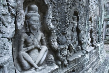 Fototapeta na wymiar Stone reliefs, buddhist figures in the Preah Khan Temple, Siem Reap, Cambodia, Southeast Asia, Asia