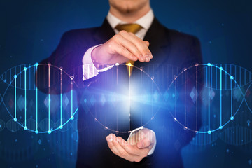 Businessman holding DNA