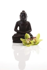 Buddha statue with orchids